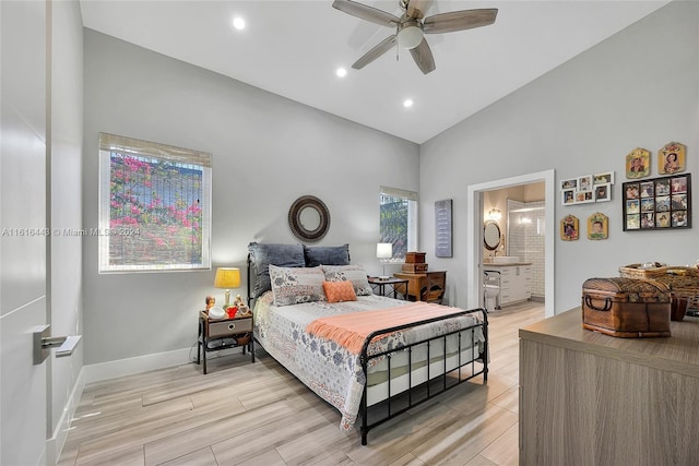 bedroom featuring ensuite bathroom, ceiling fan, and lofted ceiling