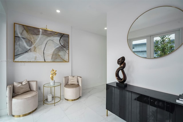 living area featuring tile patterned flooring