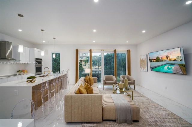 living room with sink and light tile patterned flooring