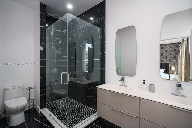 bathroom featuring toilet, double sink vanity, tile patterned flooring, and walk in shower