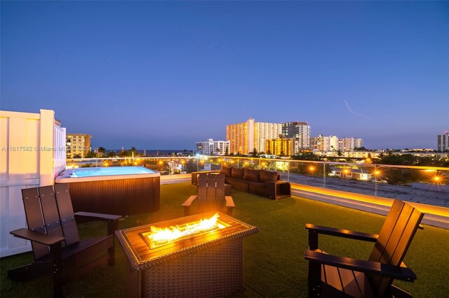 patio terrace at dusk with an outdoor fire pit