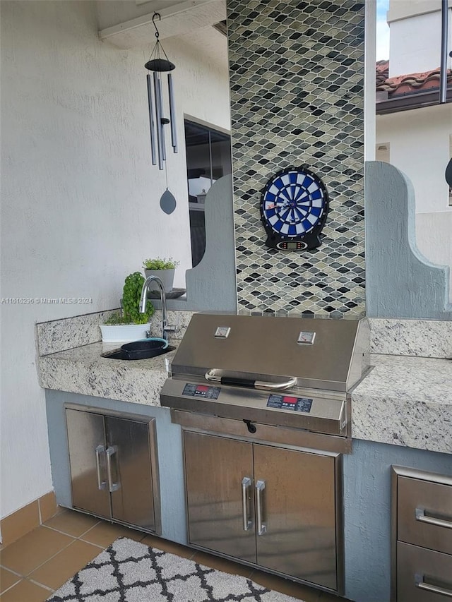 interior space featuring sink and tile patterned flooring