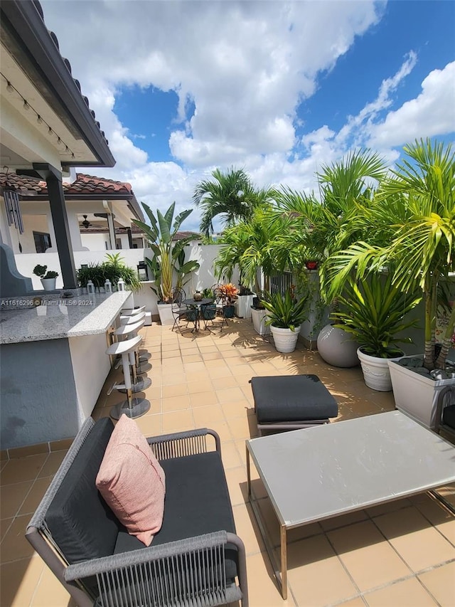 view of patio / terrace with fence and outdoor dry bar