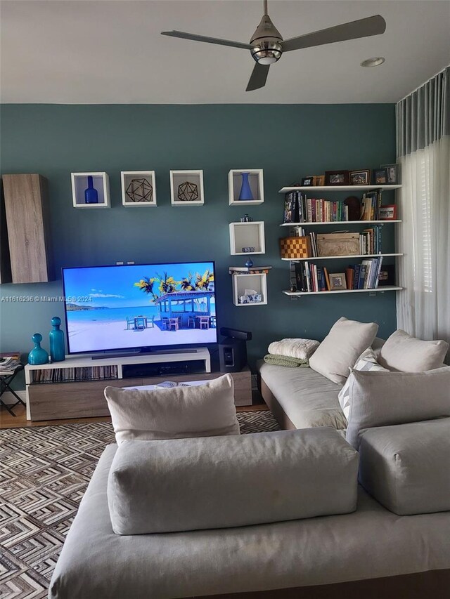 living area with a ceiling fan