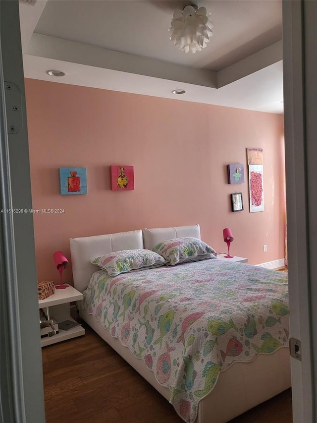 bedroom featuring dark hardwood / wood-style flooring