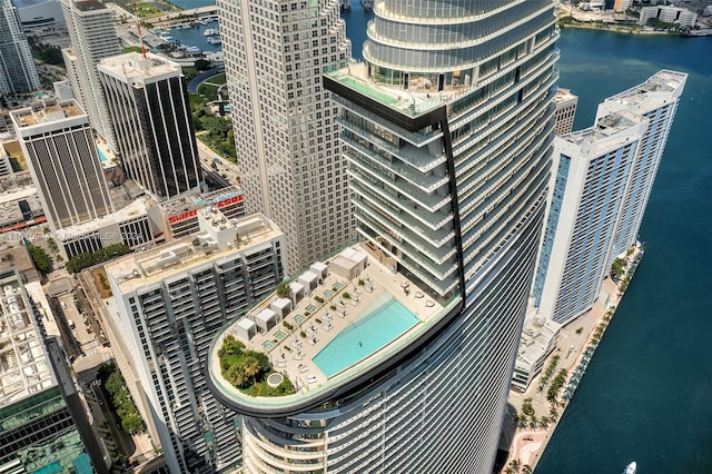 birds eye view of property with a water view