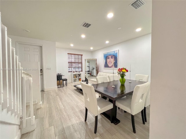 dining space featuring light wood-type flooring