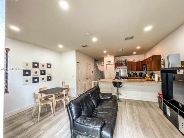 living room with light wood-type flooring