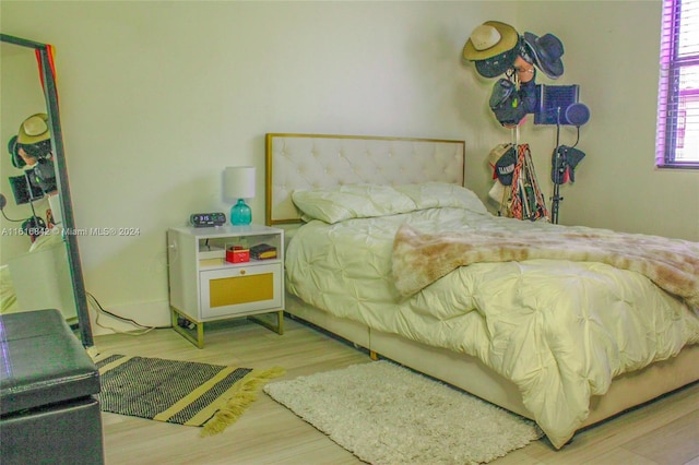 bedroom featuring wood-type flooring