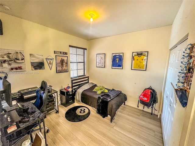 bedroom with light hardwood / wood-style flooring