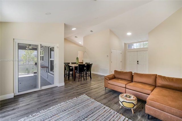 living room featuring high vaulted ceiling, a wealth of natural light, and dark hardwood / wood-style floors