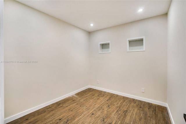 empty room with hardwood / wood-style floors