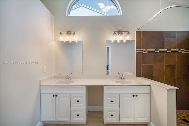 bathroom featuring tile patterned floors and dual bowl vanity