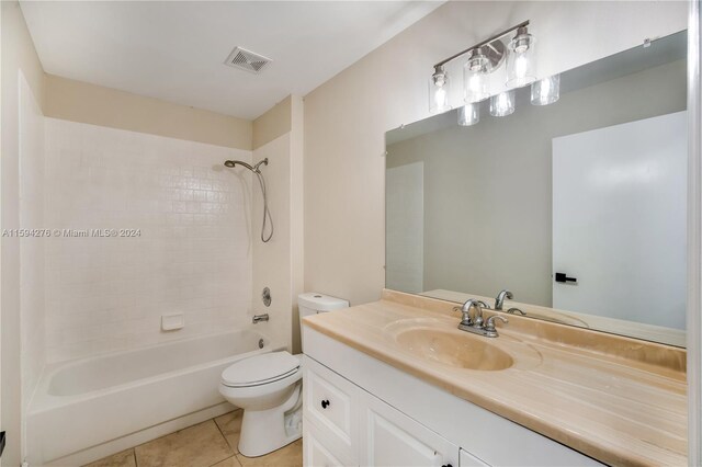 full bathroom with vanity, toilet, tile patterned floors, and  shower combination