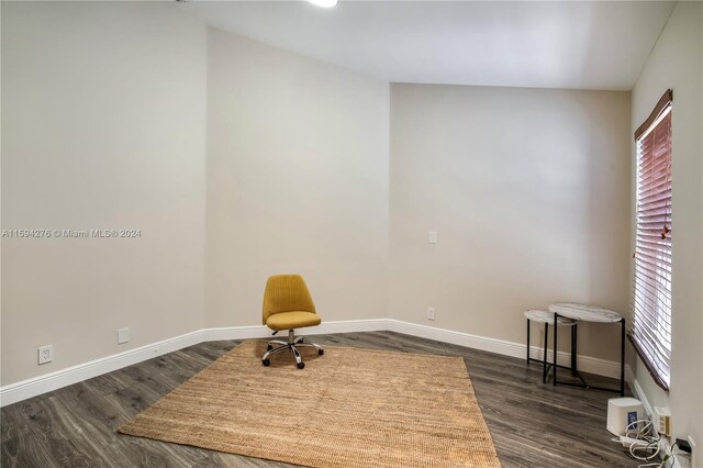 sitting room with dark hardwood / wood-style flooring