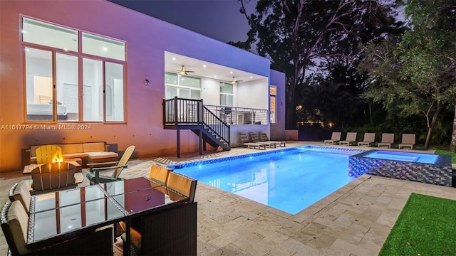 view of pool with a fire pit, an in ground hot tub, and a patio area