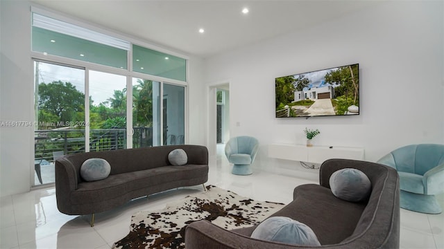 living room featuring a wall of windows