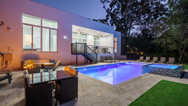 view of swimming pool featuring an in ground hot tub and a patio area