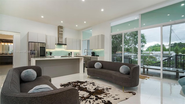 living room with sink and a towering ceiling