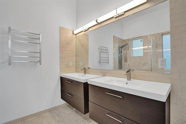 bathroom featuring tile patterned floors, an enclosed shower, and vanity