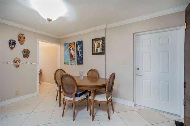 dining room with light tile patterned floors and crown molding