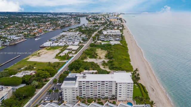 aerial view featuring a view of the beach and a water view