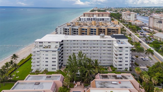 birds eye view of property with a beach view and a water view