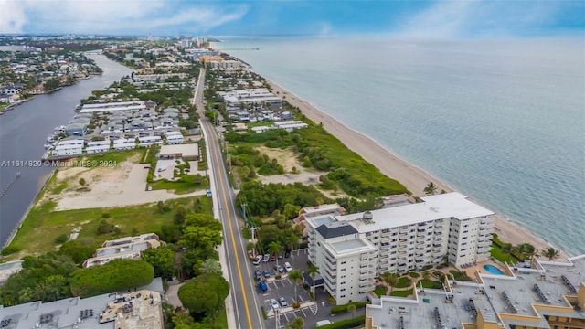 aerial view with a view of the beach and a water view