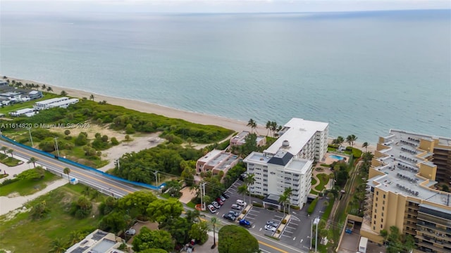 bird's eye view with a beach view and a water view