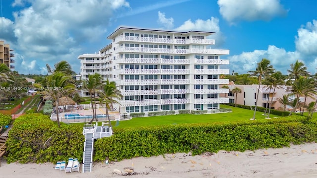 view of building exterior with a community pool