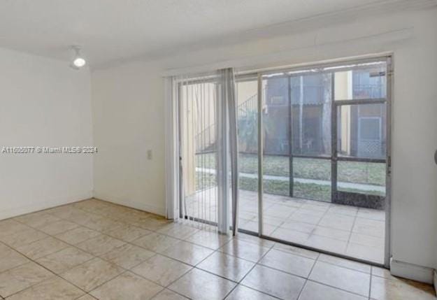 view of tiled spare room