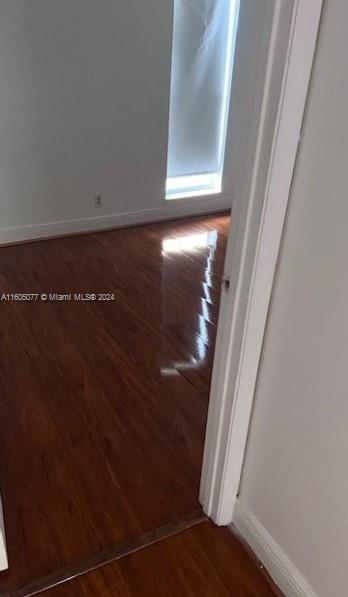 spare room featuring hardwood / wood-style flooring