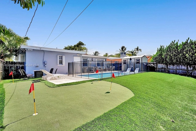 back of house featuring a fenced in pool and a patio