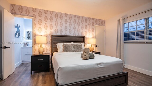 bedroom featuring dark hardwood / wood-style flooring