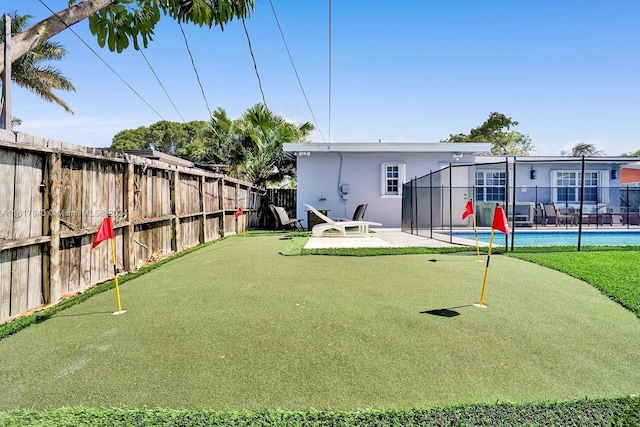 view of yard featuring a patio and a pool