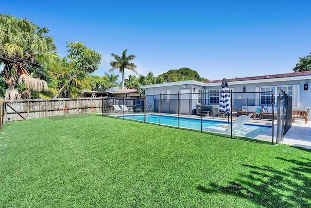 view of yard with a patio area and a fenced in pool