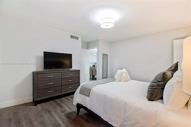 bedroom featuring dark wood-type flooring