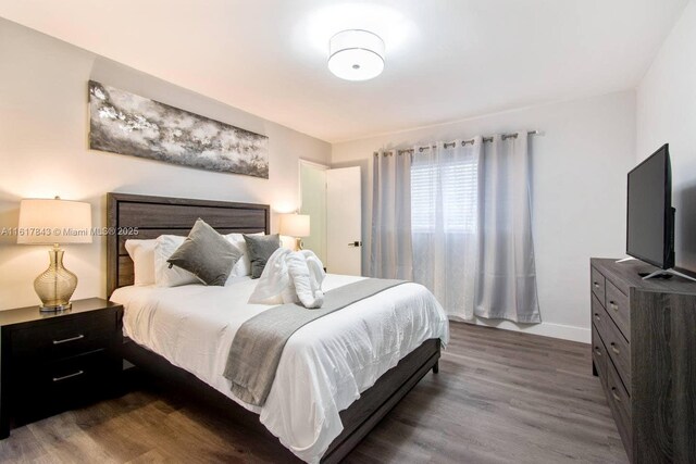 bedroom with wood-type flooring