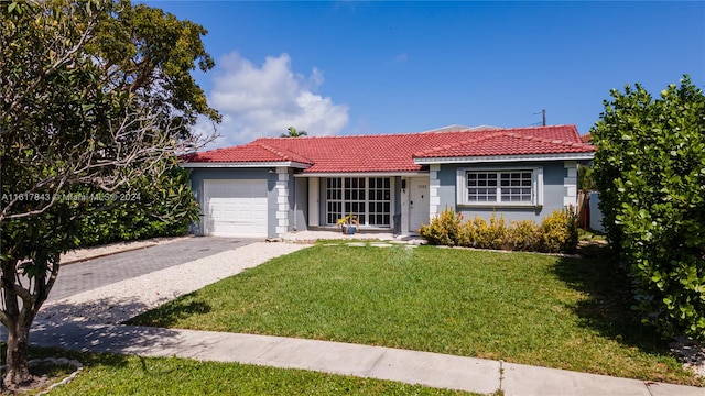 ranch-style house with a garage and a front yard