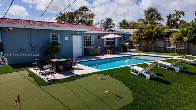 view of swimming pool with a patio