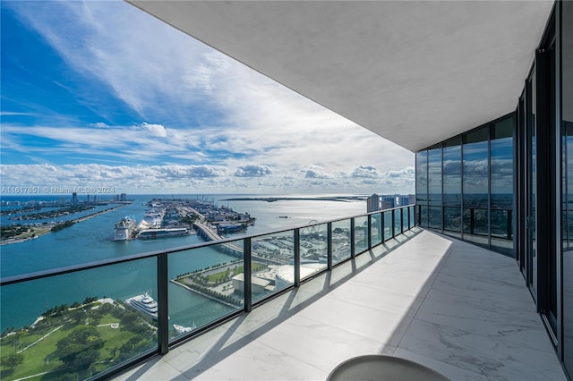 balcony featuring a water view