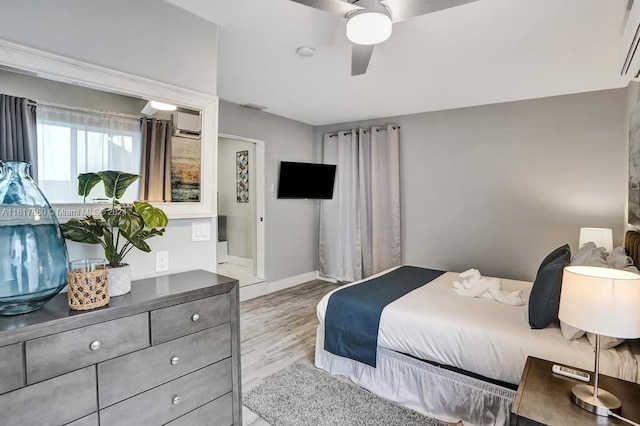 bedroom with ceiling fan and light wood-type flooring