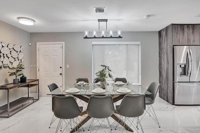 dining room featuring a chandelier