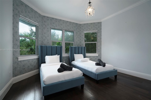 sitting room with dark hardwood / wood-style flooring, ornamental molding, and a chandelier