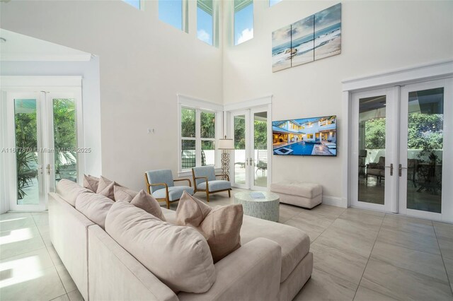 living room with french doors and light tile patterned floors