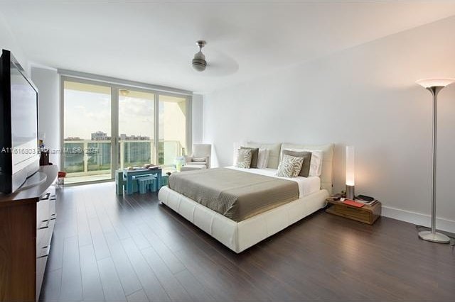 bedroom with ceiling fan, access to outside, and dark hardwood / wood-style floors