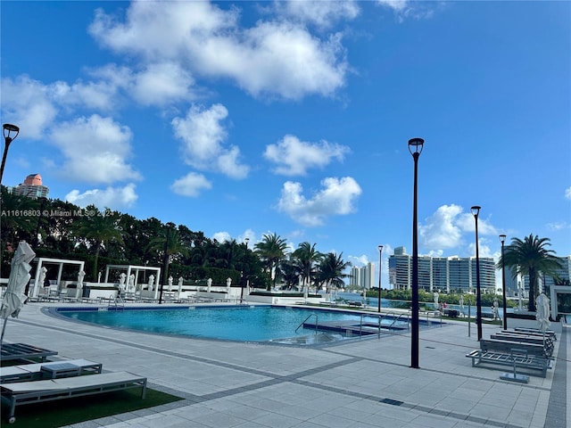 view of swimming pool featuring a patio area