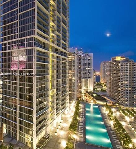 465 Brickell Ave Unit 3706, Miami, FL 33131 - pool at night featuring a view of city lights