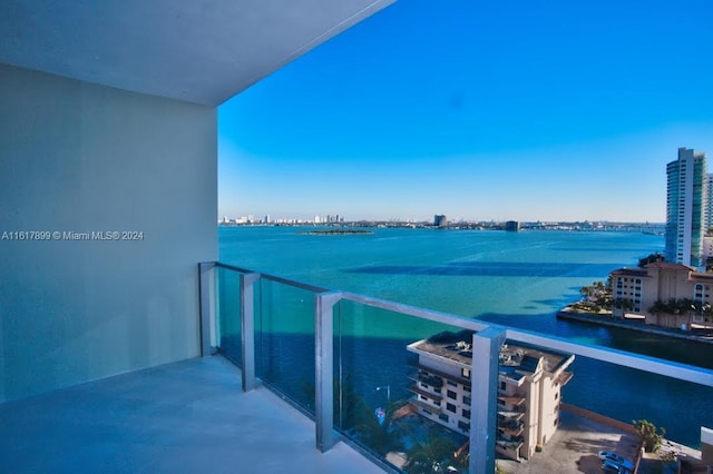 balcony featuring a water view