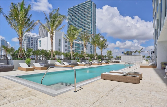 view of swimming pool featuring a patio area